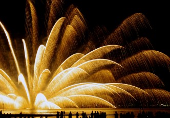 "Miyajima Water Fireworks Display" : with silhouette of Giant Torii  (A gateway entrance to the Shrine) in the sea under the Luxurious 5,000 shot of fireworks in the sky.