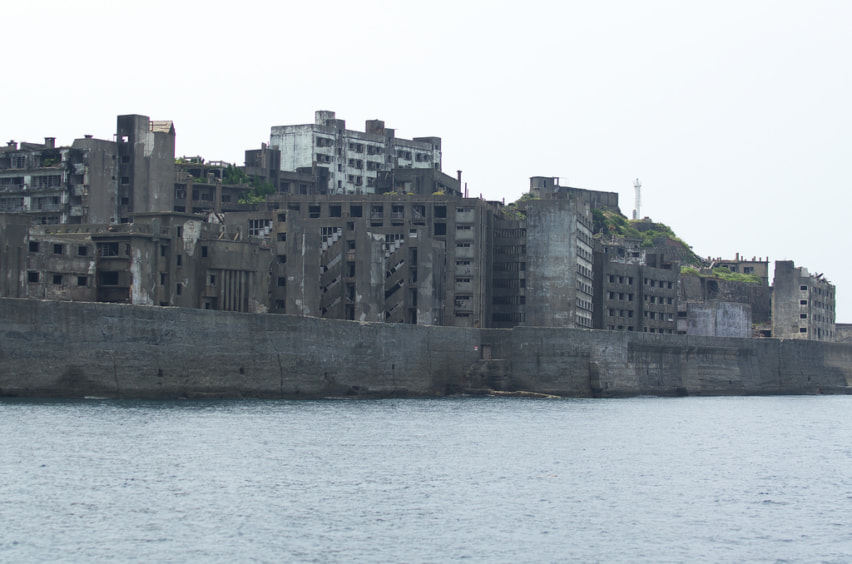 Abandoned buildings of Gunkanjima, seen from a ways offshore