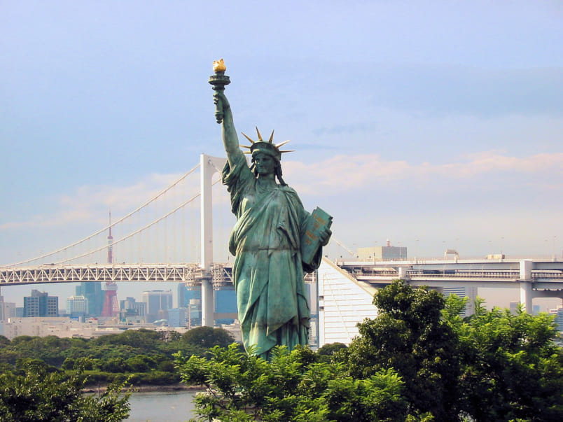 Replica Statue of Liberty with Rainbow Bridge behind it