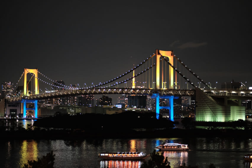Rainbow Bridge lit up at night