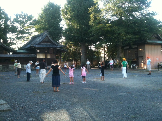 People doing radio calisthenics at a Japanese shrine