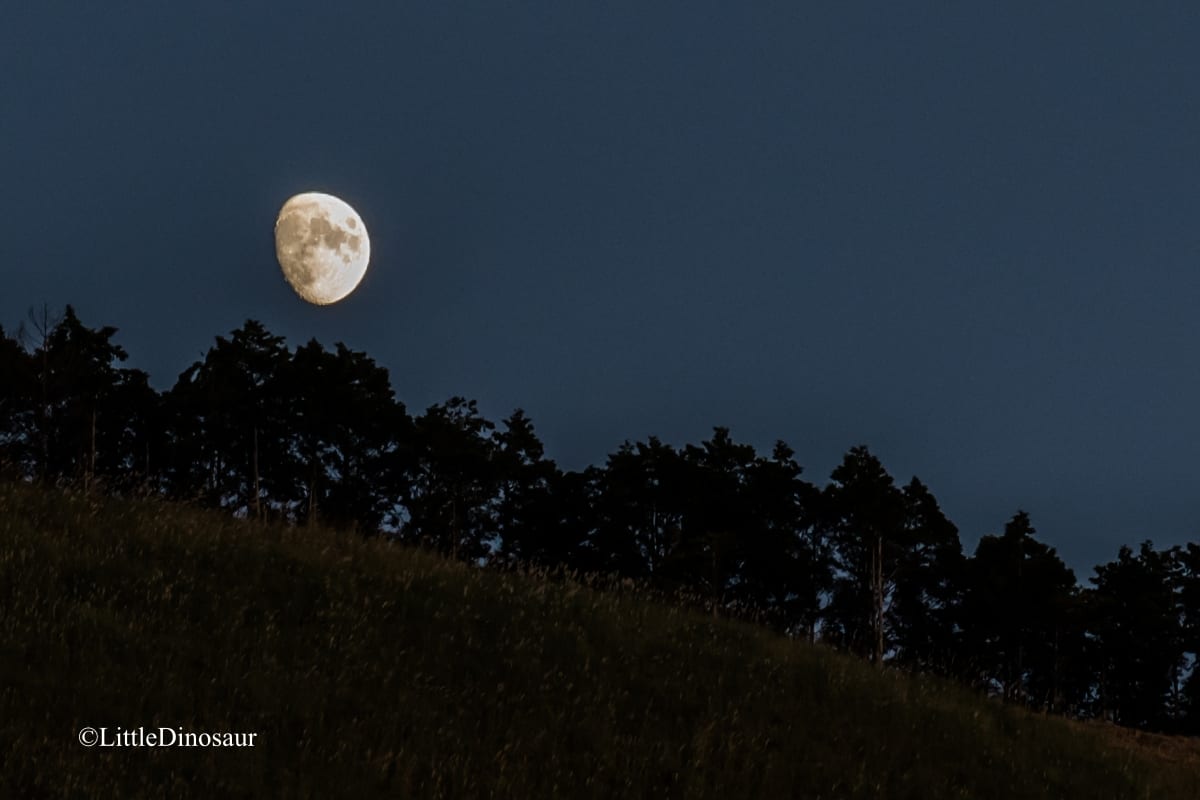 The moon over a darkened Soni Highlands