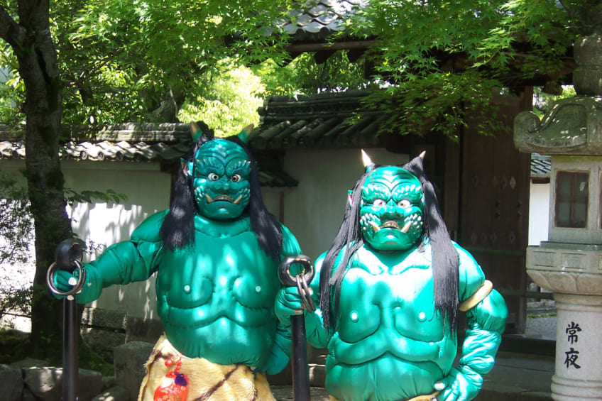 two statues of blue-green ao oni