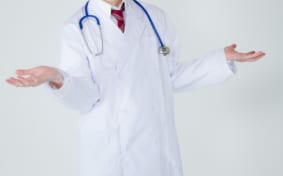 Doctor's torso with hands open out